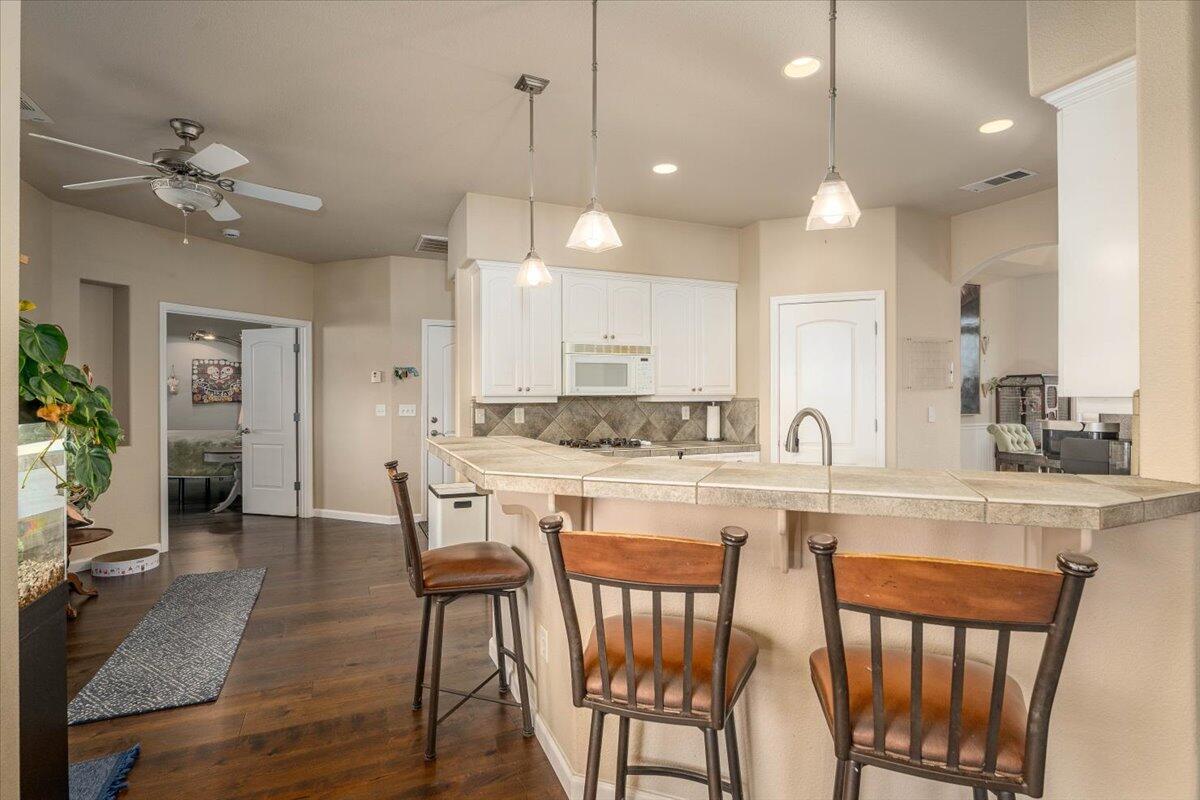 2122 Edinburgh Way Redding, CA 96003 - Photo 12 of 61 a large kitchen with a table and chairs in it