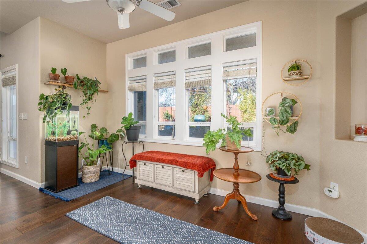 2122 Edinburgh Way Redding, CA 96003 - Photo 13 of 61 a bedroom with a bed potted plant and a potted plant