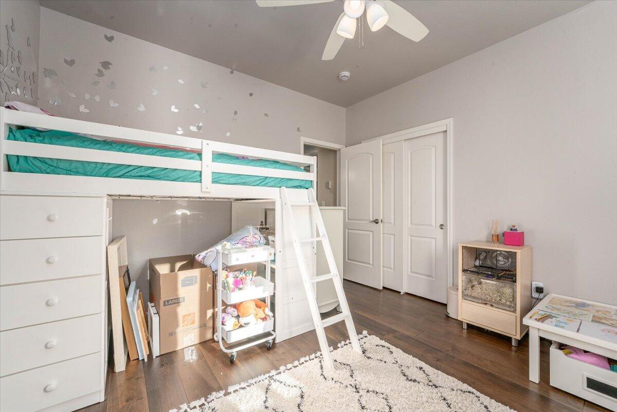 2122 Edinburgh Way Redding, CA 96003 - Photo 26 of 61 a living room with furniture and a wooden floor