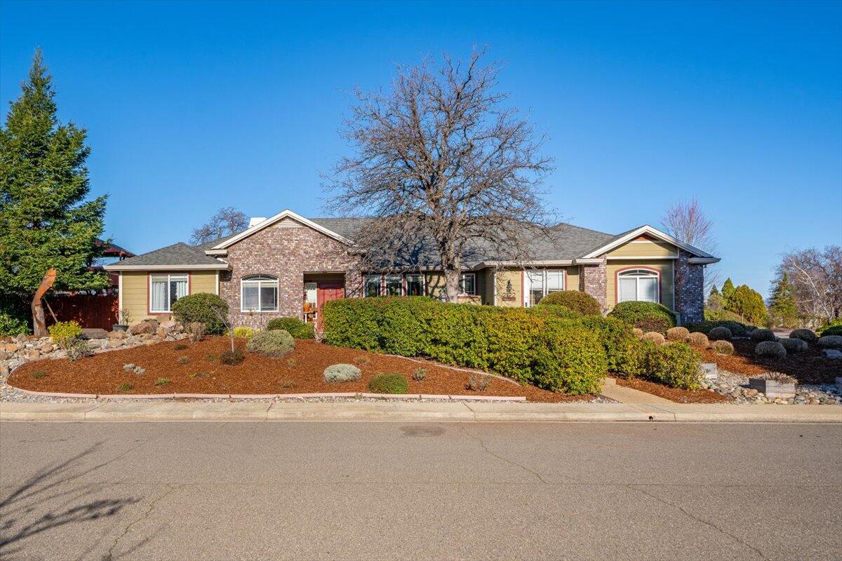 2122 Edinburgh Way Redding, CA 96003 - Photo 42 of 61 a front view of a house with a yard