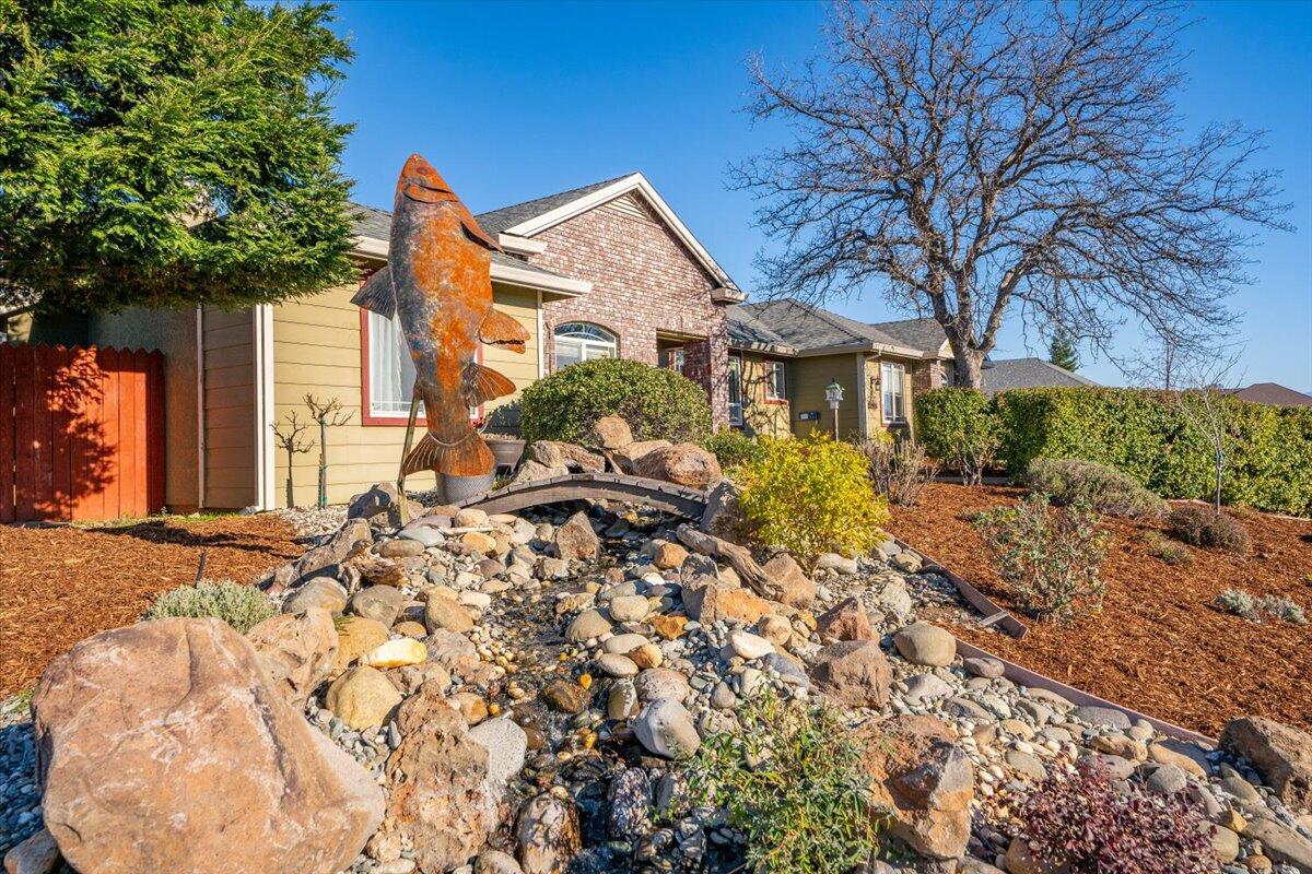 2122 Edinburgh Way Redding, CA 96003 - Photo 43 of 61 a front view of a house with a yard