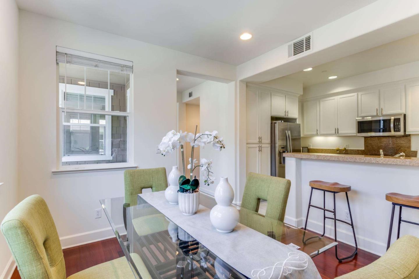 100 Live Oak Way, Unit 104 Belmont, CA 94002 - Photo 12 of 37 a living room with furniture kitchen view and a refrigerator