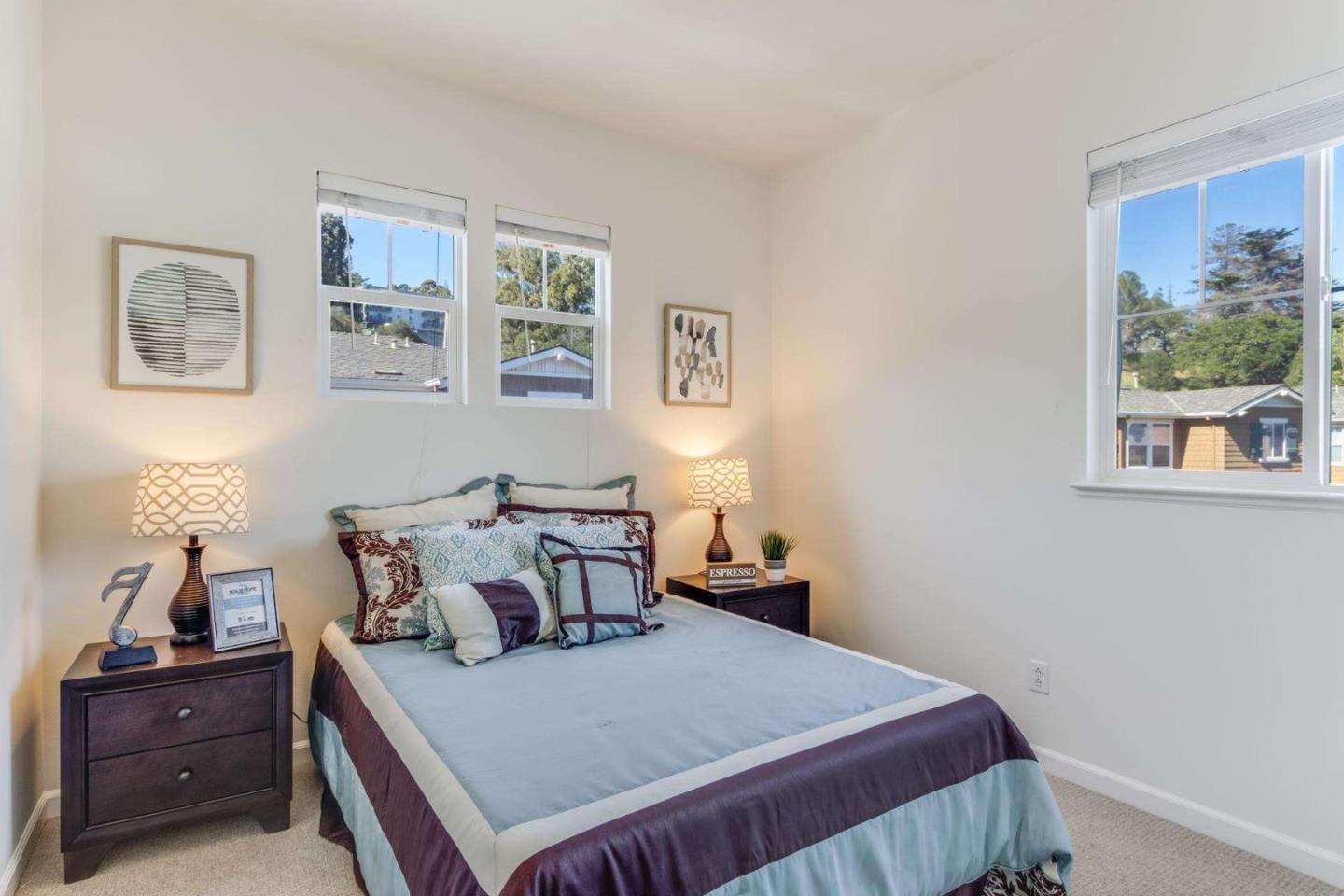 100 Live Oak Way, Unit 104 Belmont, CA 94002 - Photo 19 of 37 a bedroom with a bed and window