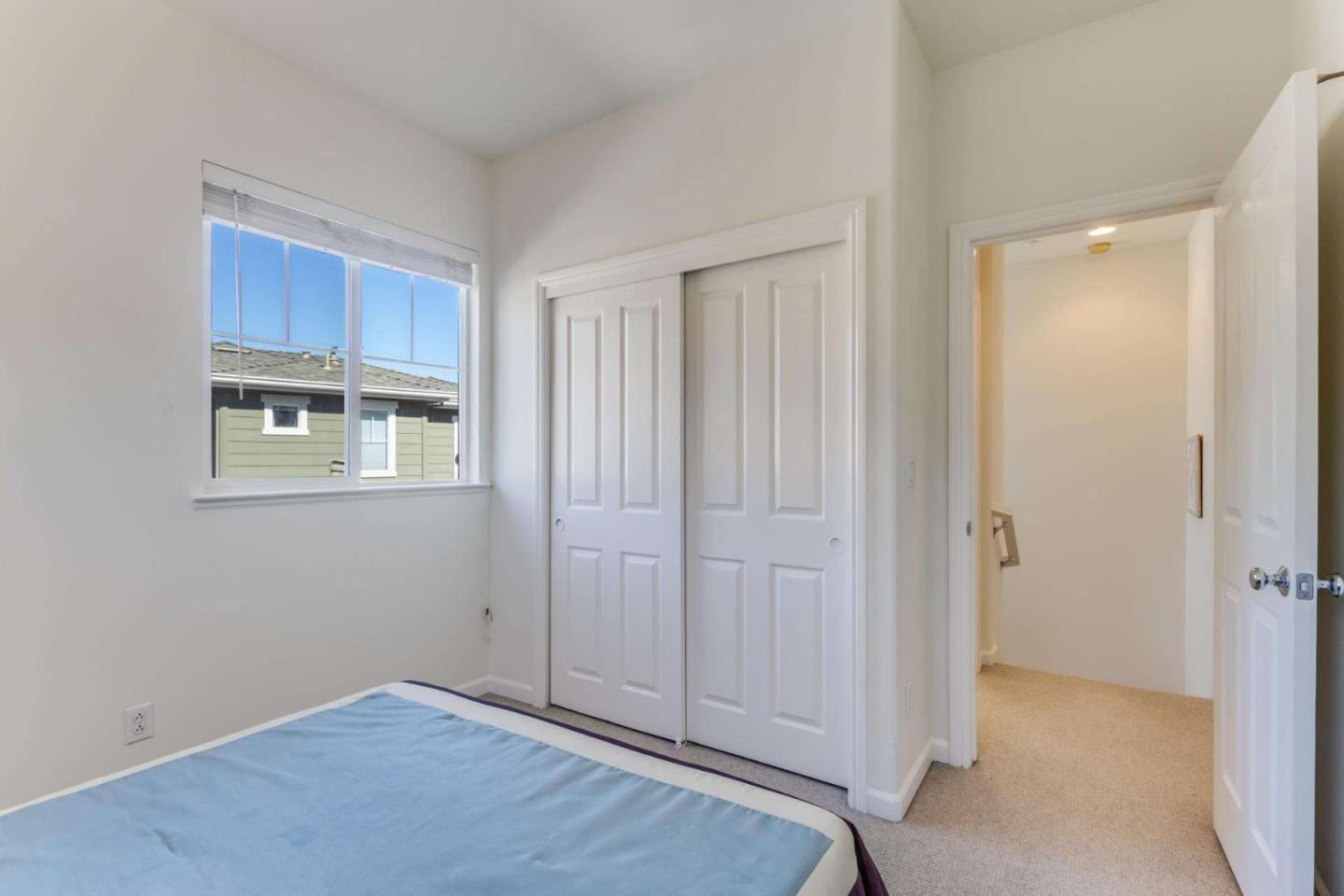 100 Live Oak Way, Unit 104 Belmont, CA 94002 - Photo 22 of 37 an empty room with windows and cabinet