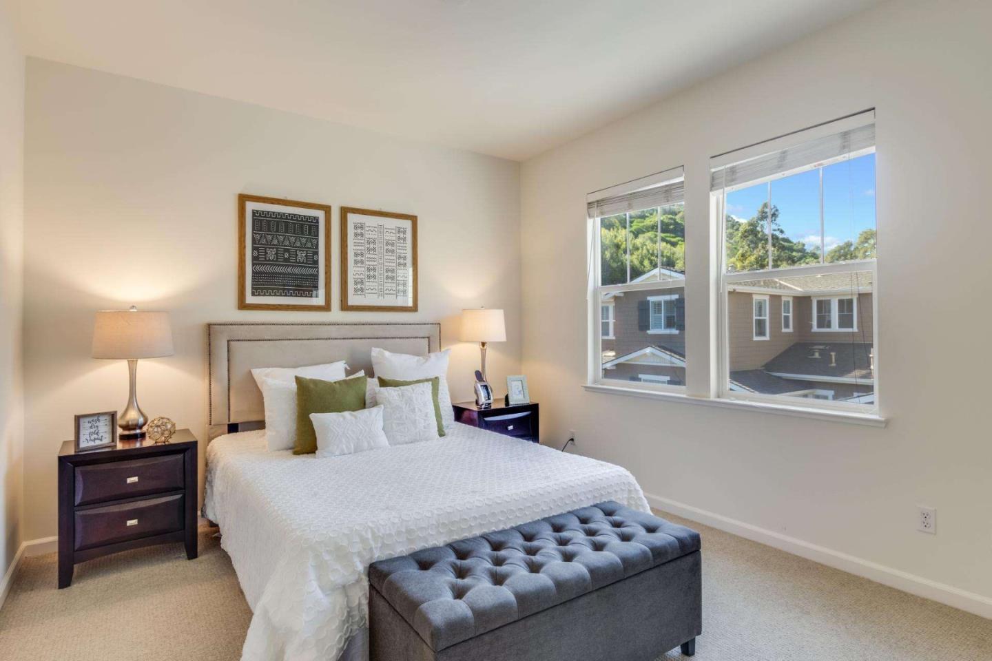 100 Live Oak Way, Unit 104 Belmont, CA 94002 - Photo 24 of 37 a bedroom with a bed and a night stand