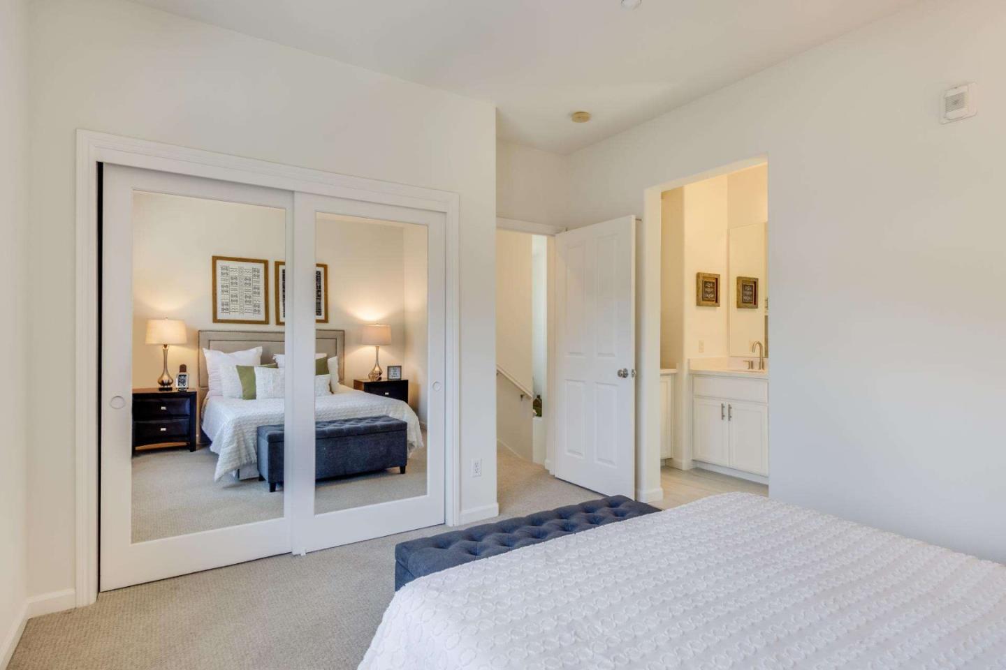 100 Live Oak Way, Unit 104 Belmont, CA 94002 - Photo 26 of 37 a bedroom with a bed and gym equipment