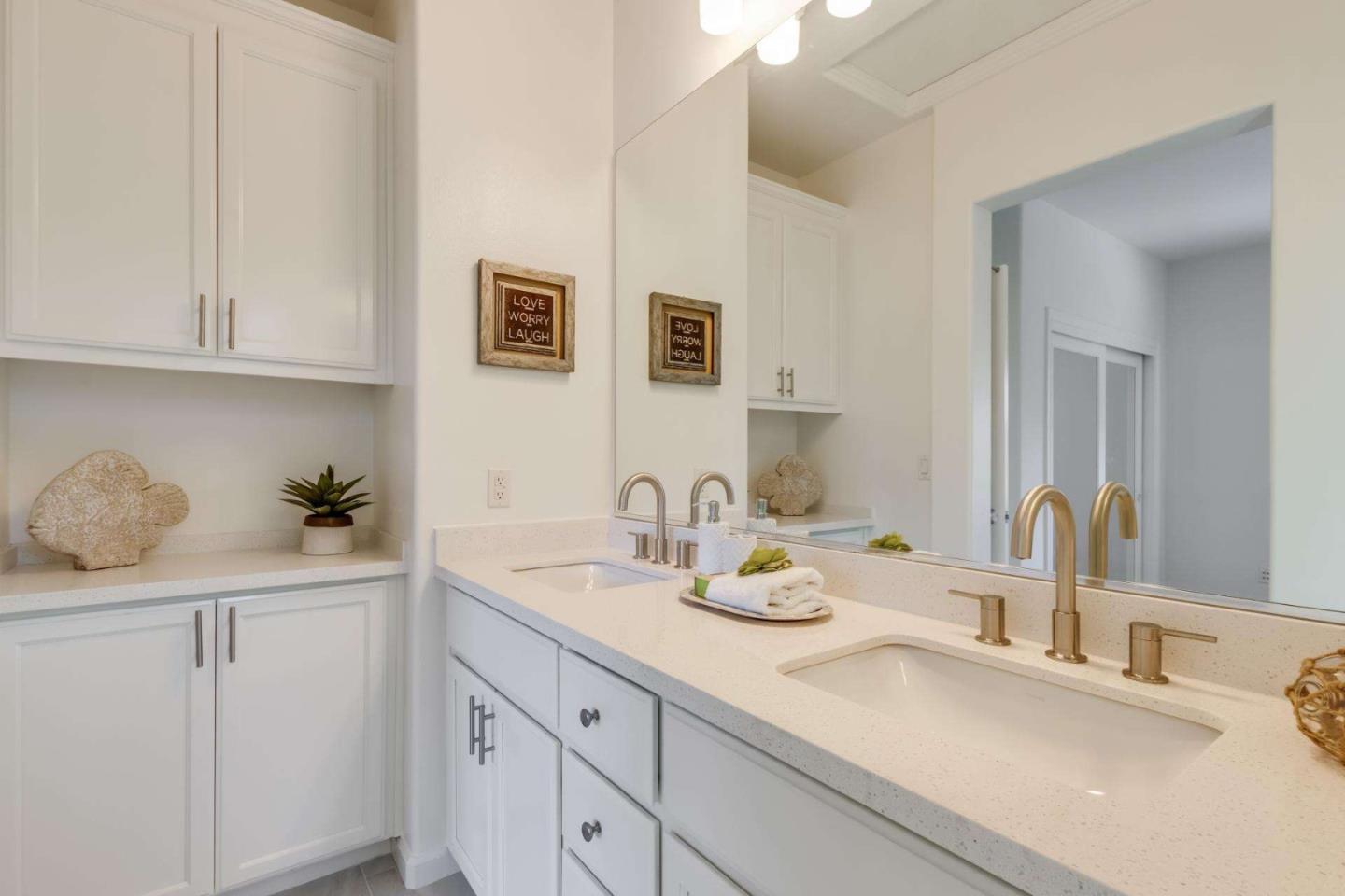 100 Live Oak Way, Unit 104 Belmont, CA 94002 - Photo 30 of 37 a bathroom with a sink and a mirror