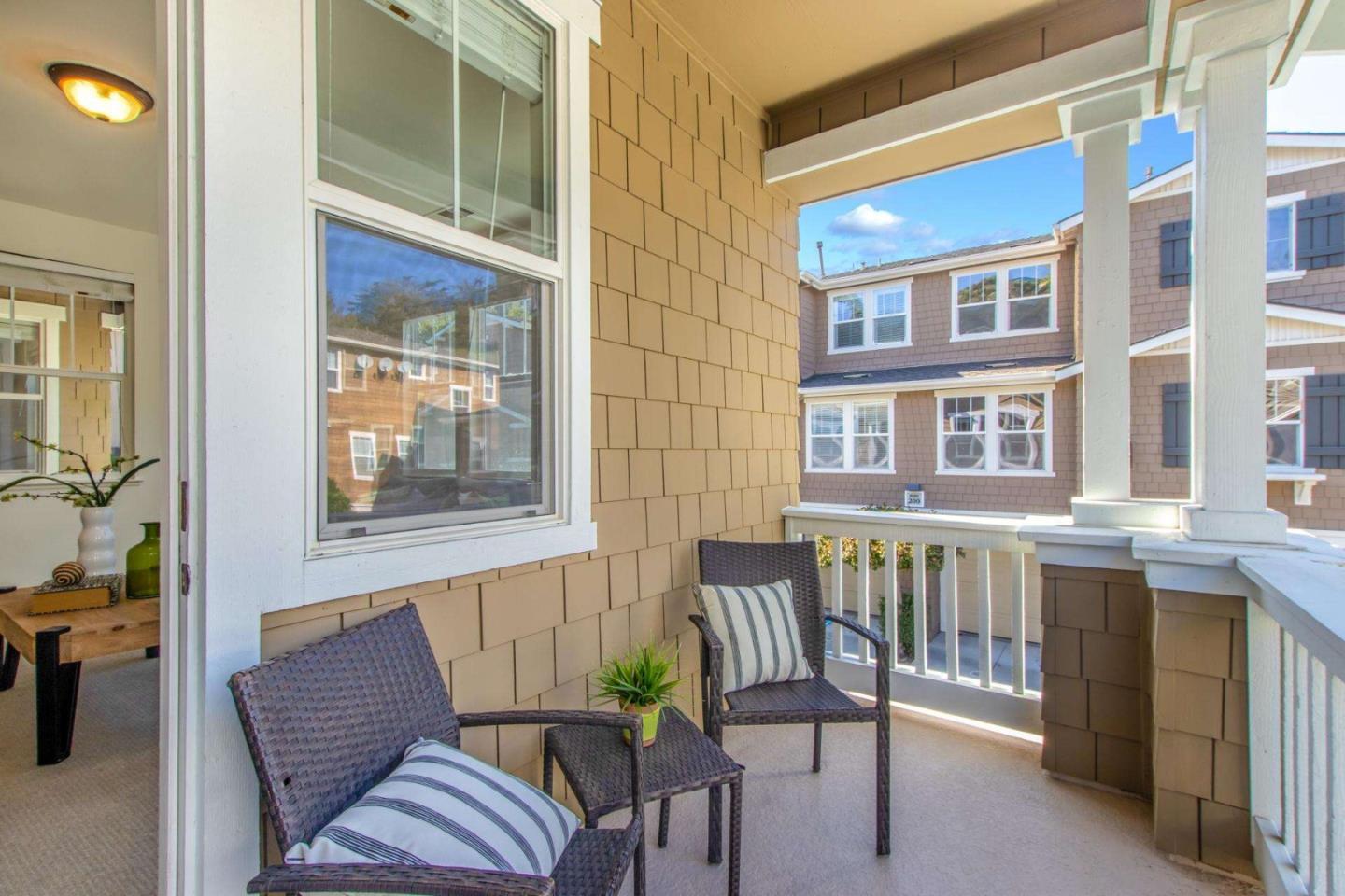 100 Live Oak Way, Unit 104 Belmont, CA 94002 - Photo 32 of 37 a view of a chair and table in the balcony
