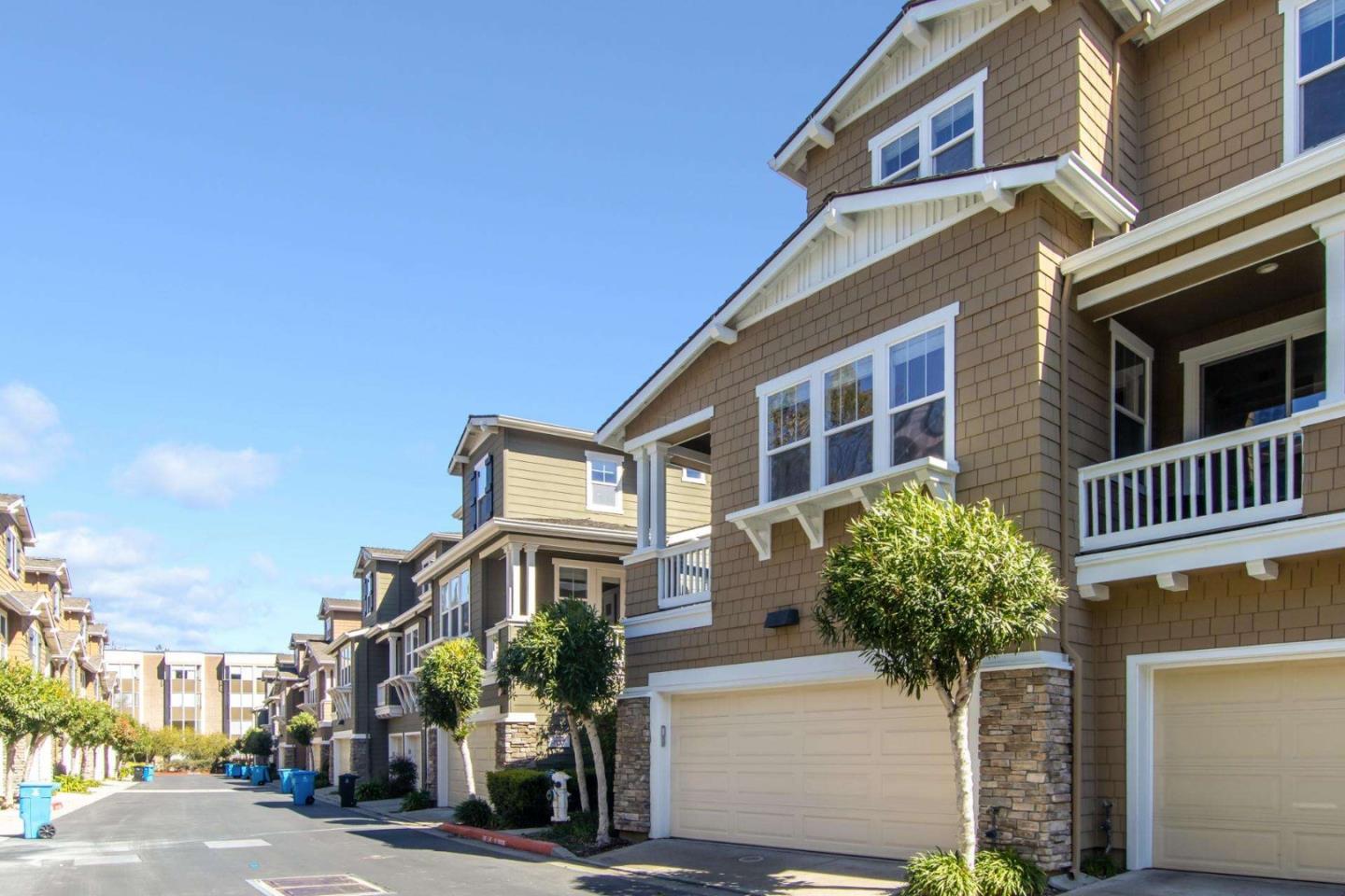 100 Live Oak Way, Unit 104 Belmont, CA 94002 - Photo 34 of 37 a front view of a house with a yard