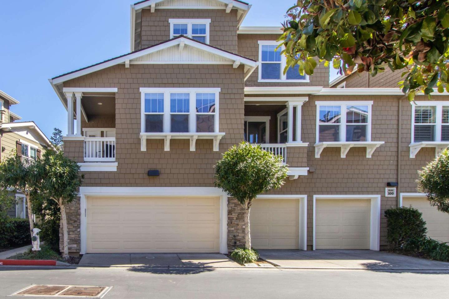 100 Live Oak Way, Unit 104 Belmont, CA 94002 - Photo 35 of 37 a front view of a house with a yard and garage