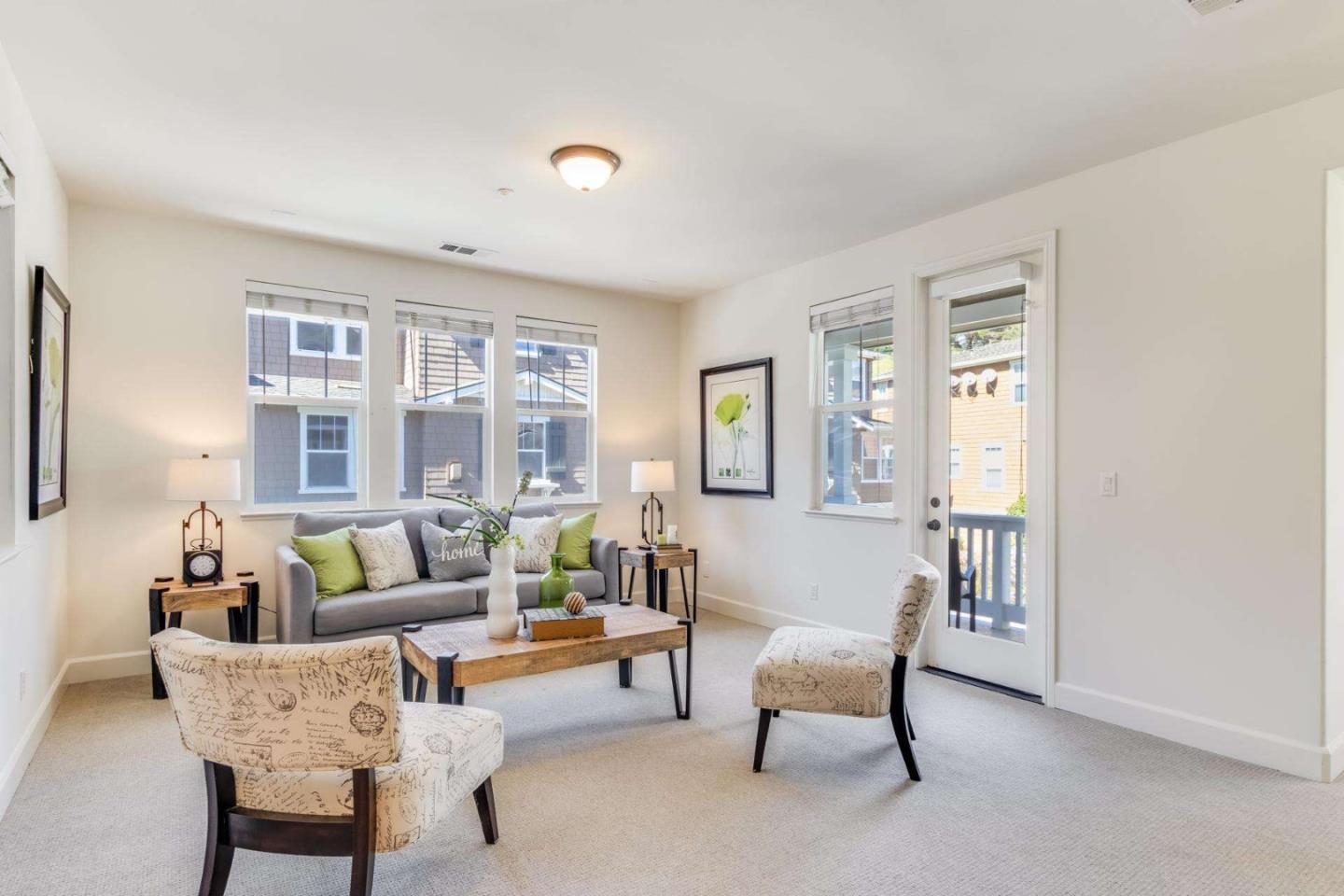 100 Live Oak Way, Unit 104 Belmont, CA 94002 - Photo 4 of 37 a living room with furniture and floor to ceiling windows