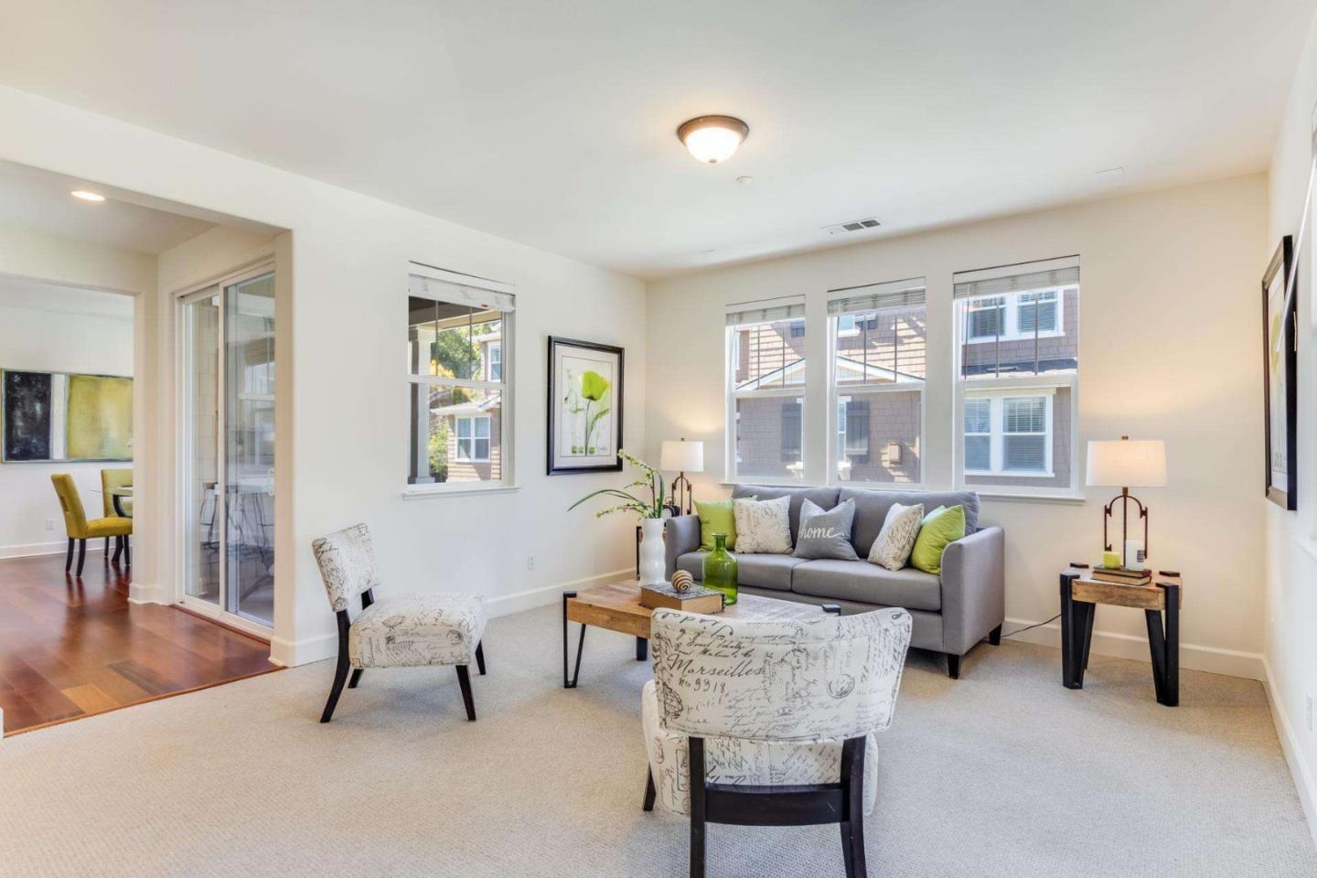 100 Live Oak Way, Unit 104 Belmont, CA 94002 - Photo 5 of 37 a living room with furniture and a large window