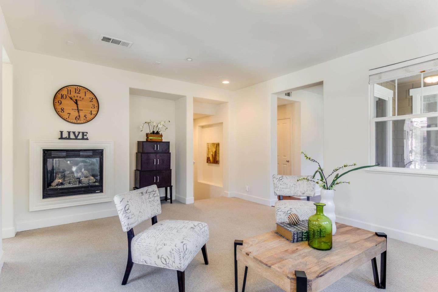 100 Live Oak Way, Unit 104 Belmont, CA 94002 - Photo 6 of 37 a living room with furniture and a table