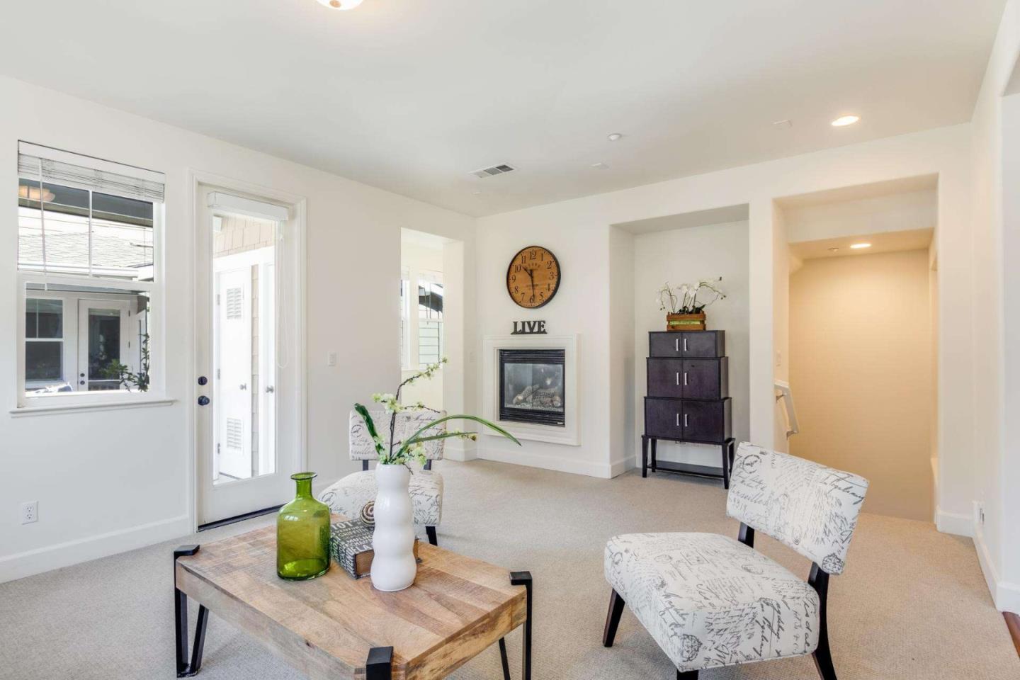 100 Live Oak Way, Unit 104 Belmont, CA 94002 - Photo 7 of 37 a living room with furniture wooden floor and a fireplace