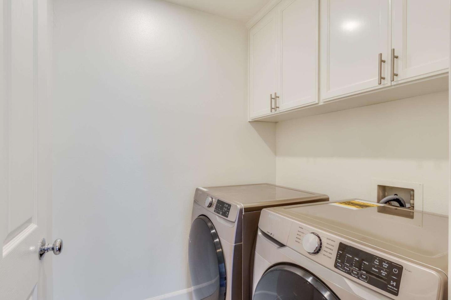 100 Live Oak Way, Unit 104 Belmont, CA 94002 - Photo 8 of 37 a utility room with dryer and washer