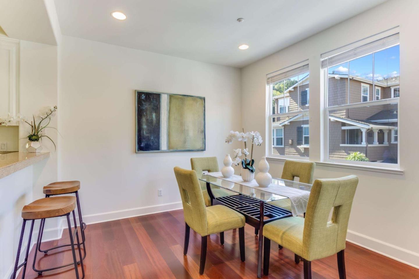 100 Live Oak Way, Unit 104 Belmont, CA 94002 - Photo 9 of 37 a view of a dining room with furniture and wooden floor
