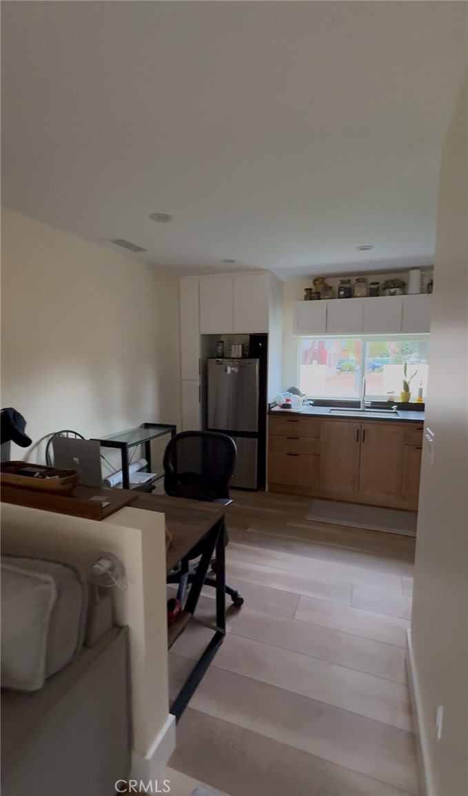 18727 Bassett Street Reseda, CA 91335 - Photo 2 of 8 a bed room with a bed and furniture