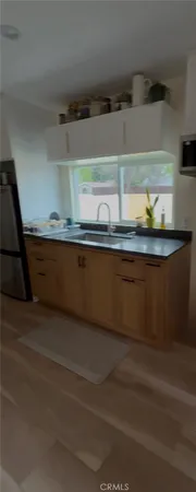 a close view of sink and cabinets
