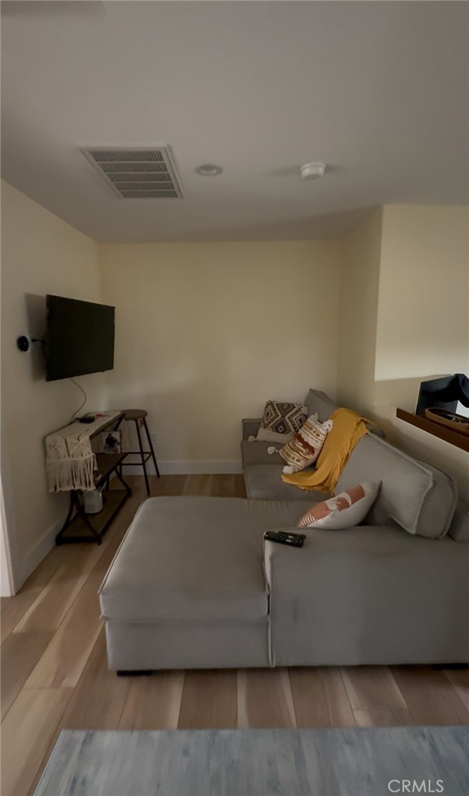 18727 Bassett Street Reseda, CA 91335 - Photo 4 of 8 a living room with furniture