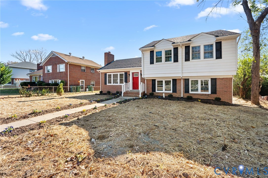 8005 Three Chopt Road Henrico, VA 23229 - Photo 2 of 28 a front view of a house with a yard