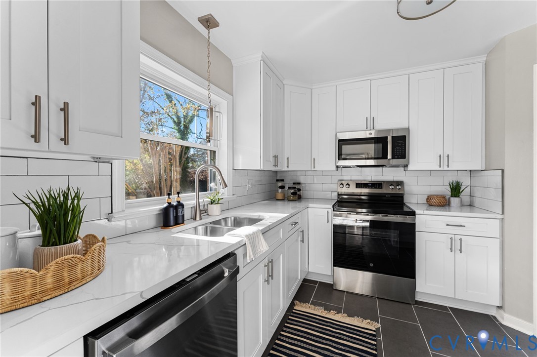 8005 Three Chopt Road Henrico, VA 23229 - Photo 7 of 28 a kitchen with a sink stove and microwave