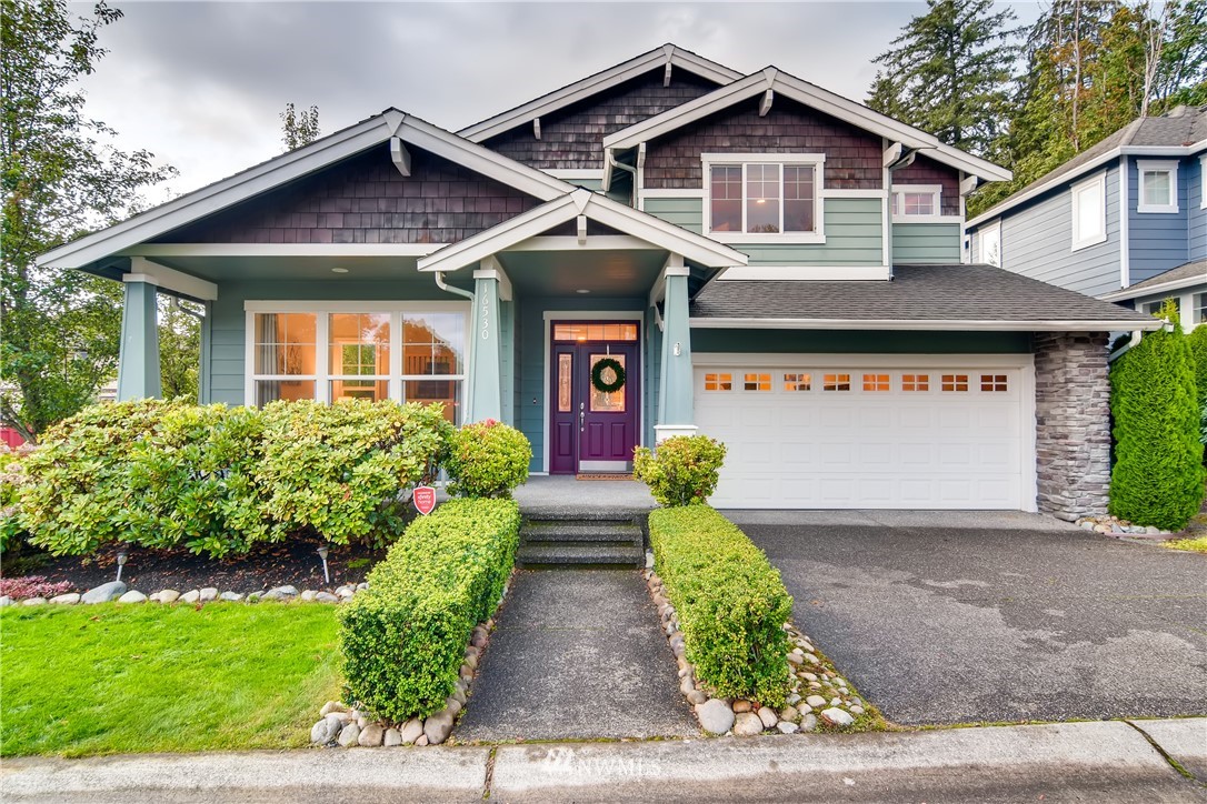 16530 Parkside Way Southeast Renton, WA 98058 - Photo 1 of 25 a front view of a house with garden