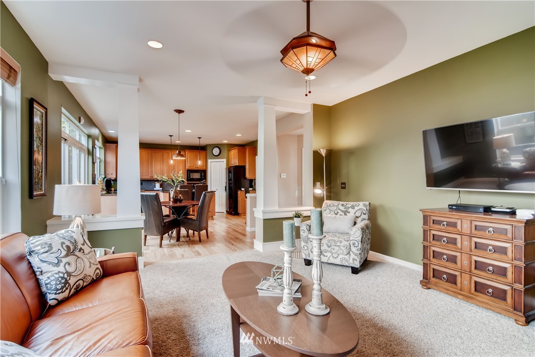16530 Parkside Way Southeast Renton, WA 98058 - Photo 12 of 25 a living room with furniture and a flat screen tv