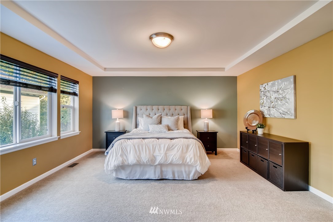 16530 Parkside Way Southeast Renton, WA 98058 - Photo 14 of 25 a bedroom with a bed and a large window