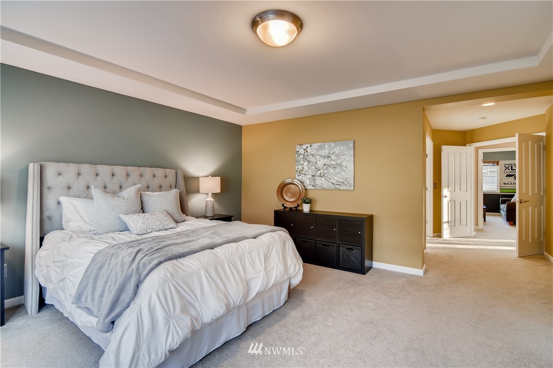 16530 Parkside Way Southeast Renton, WA 98058 - Photo 15 of 25 a bedroom with a bed and a couch