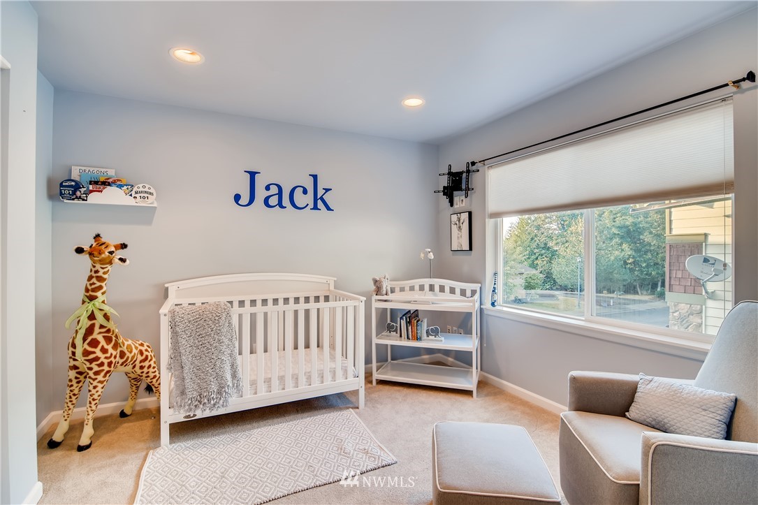 16530 Parkside Way Southeast Renton, WA 98058 - Photo 16 of 25 a bedroom with furniture and a large window