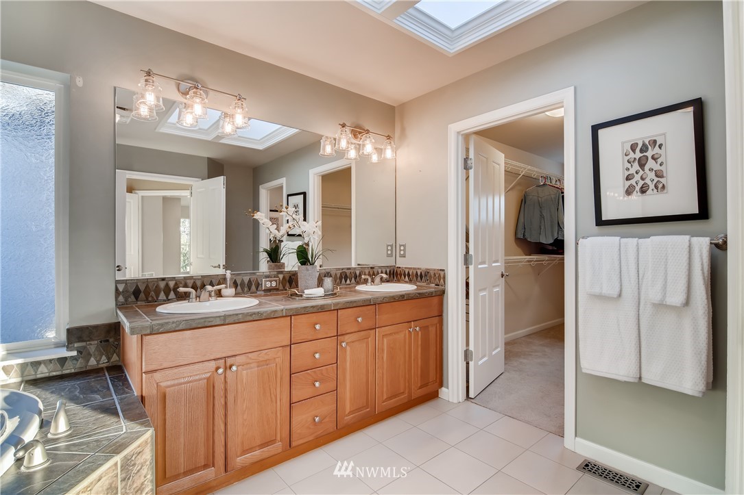 16530 Parkside Way Southeast Renton, WA 98058 - Photo 17 of 25 a bathroom with a sink a vanity and a mirror
