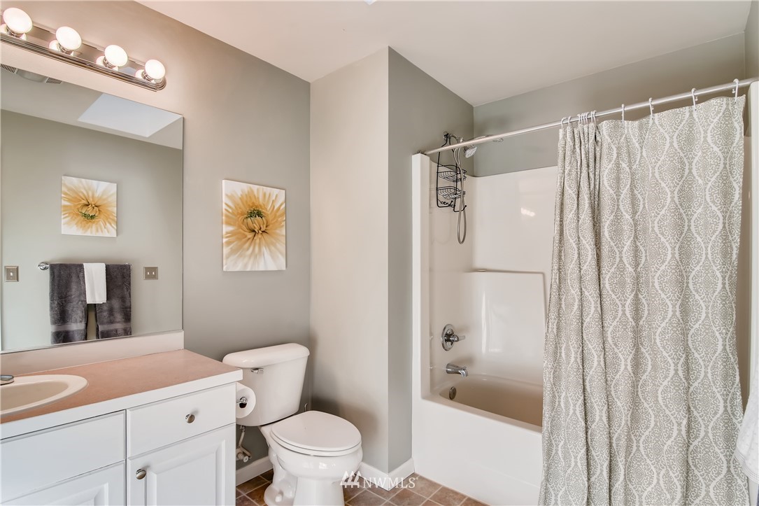 16530 Parkside Way Southeast Renton, WA 98058 - Photo 20 of 25 a bathroom with a granite countertop sink toilet and shower