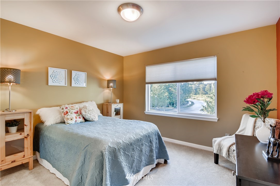 16530 Parkside Way Southeast Renton, WA 98058 - Photo 21 of 25 a bedroom with a bed and a window