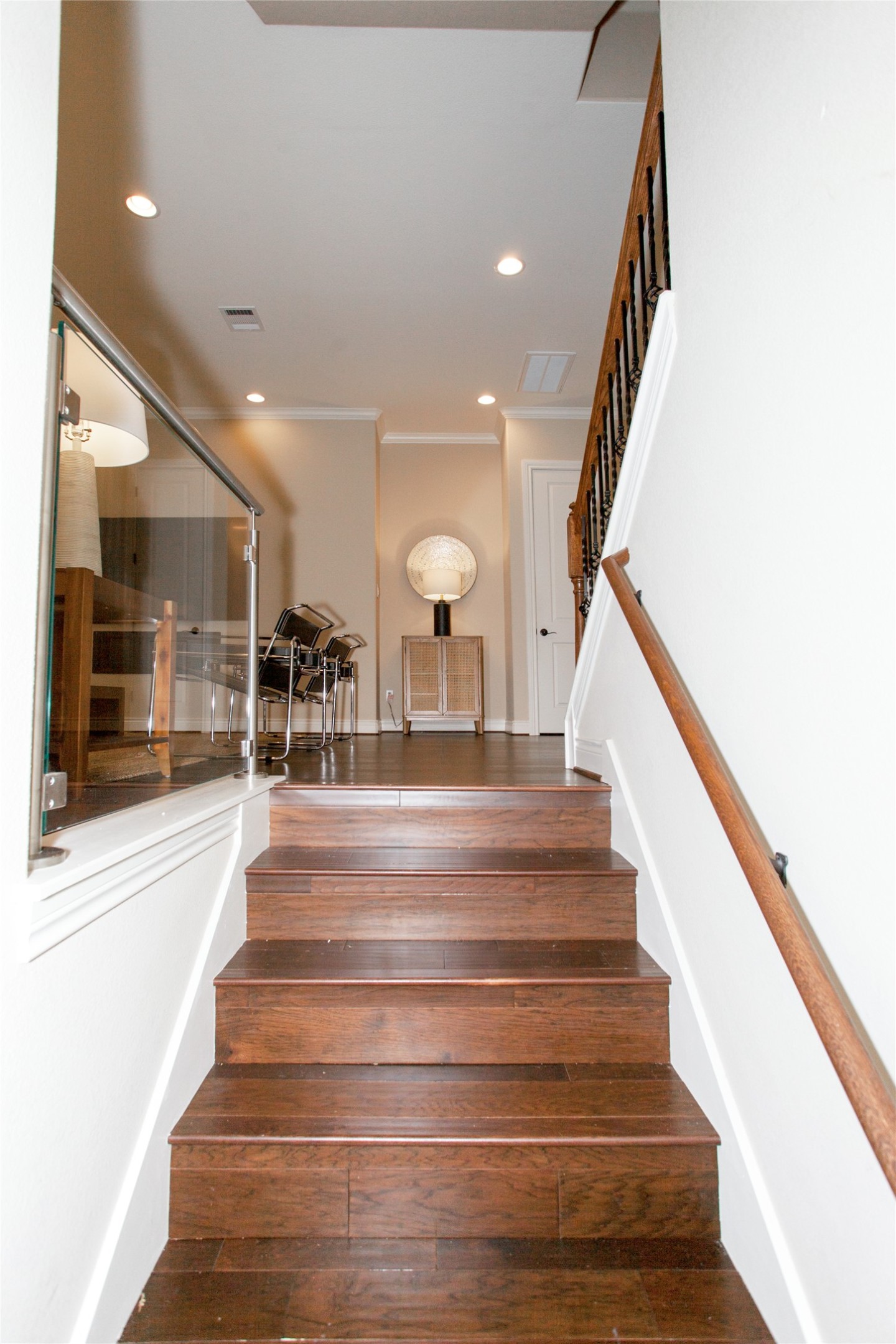 224 Adams Street Georgetown, TX 78628 - Photo 11 of 34 a view of staircase with lots of frames and a rug
