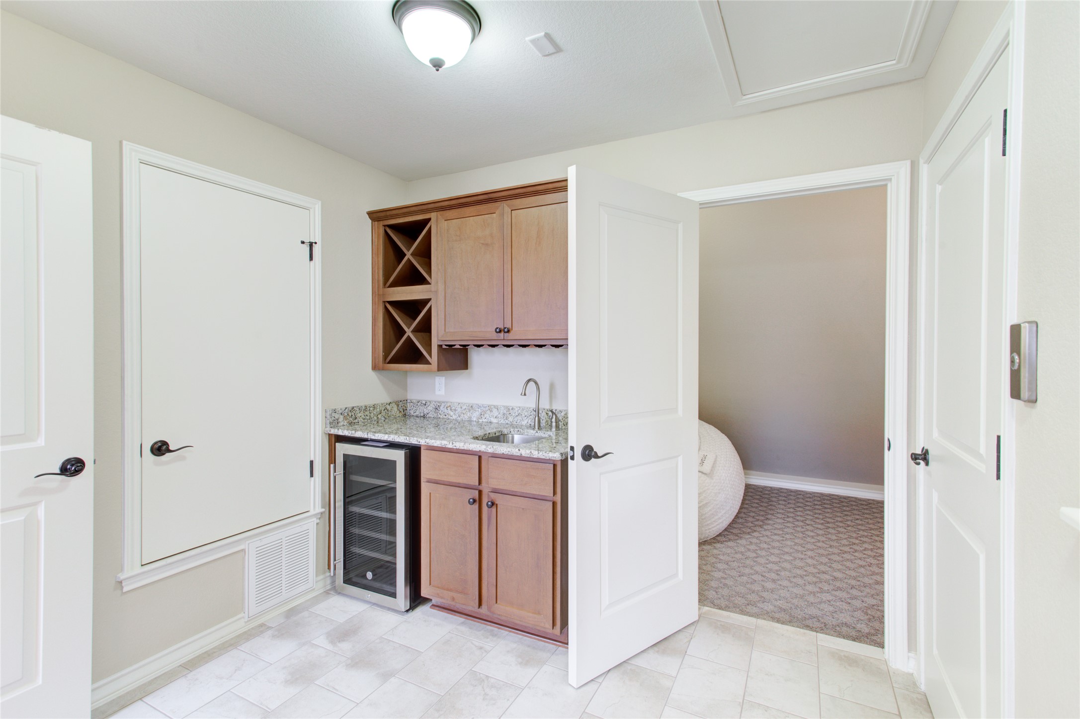 224 Adams Street Georgetown, TX 78628 - Photo 8 of 34 a bathroom with a granite countertop sink and a mirror
