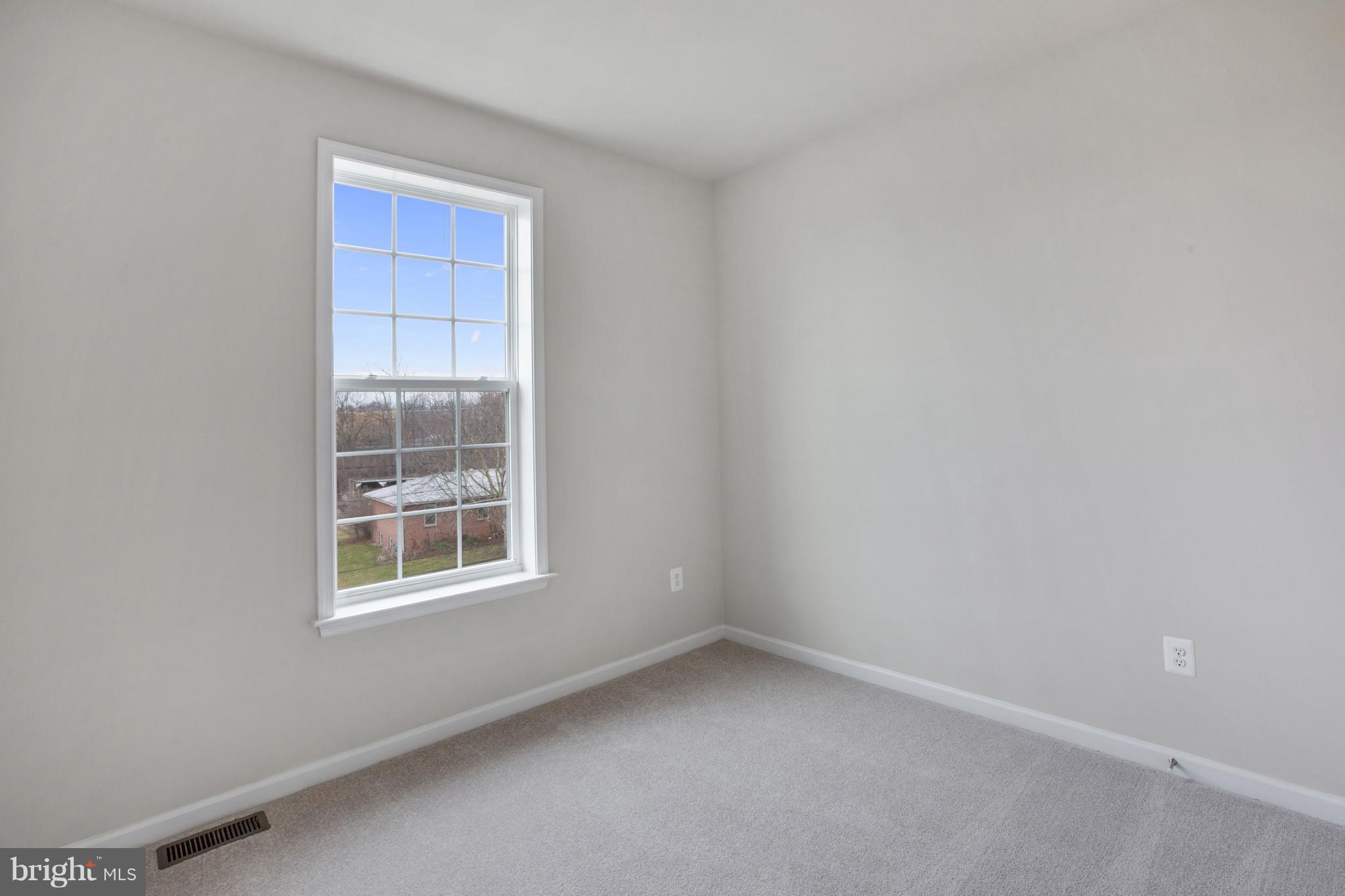 7873 Wormans Mill Road Frederick, MD 21701 - Photo 22 of 30 an empty room with a window