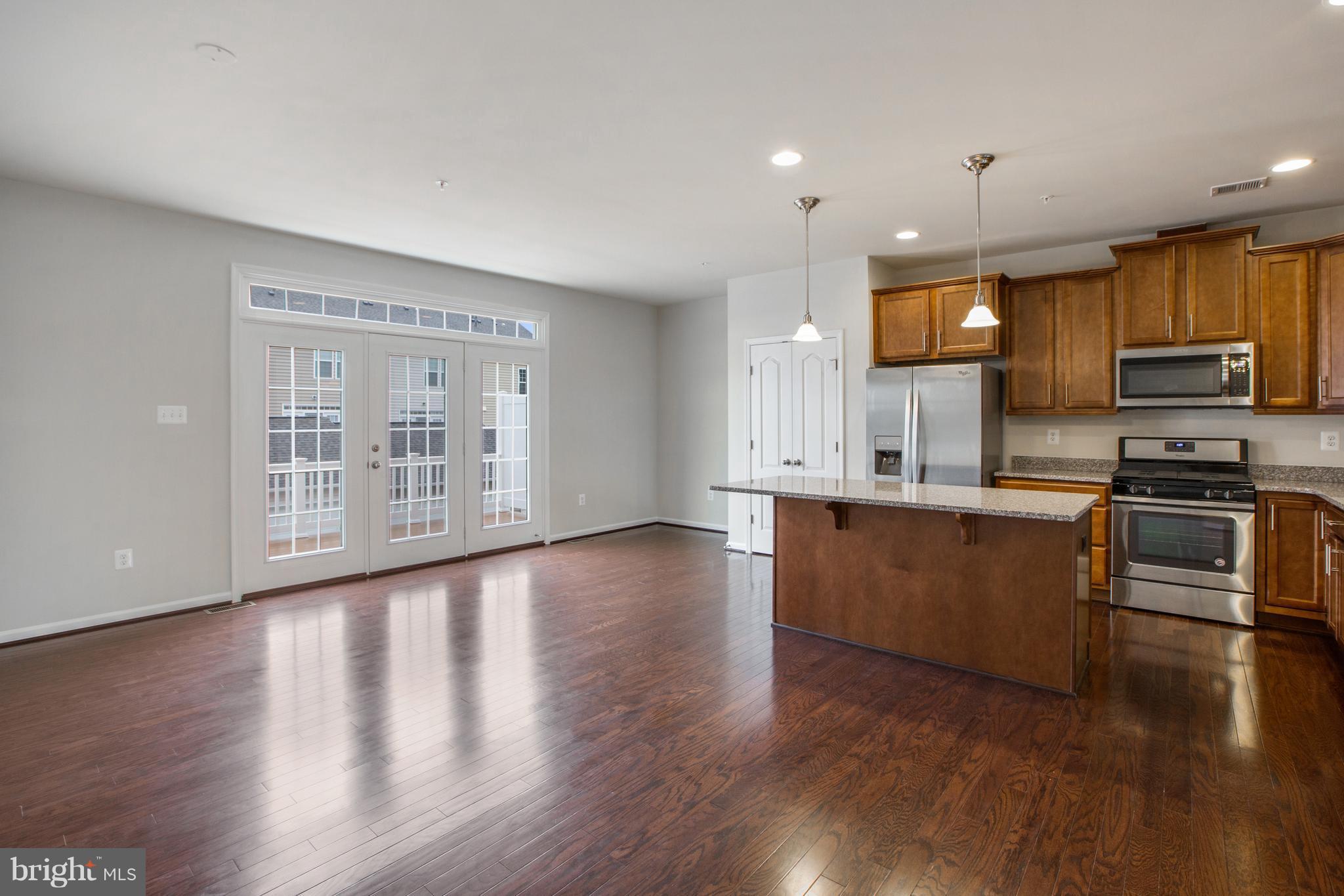 7873 Wormans Mill Road Frederick, MD 21701 - Photo 6 of 30 a kitchen with stainless steel appliances a refrigerator sink and microwave