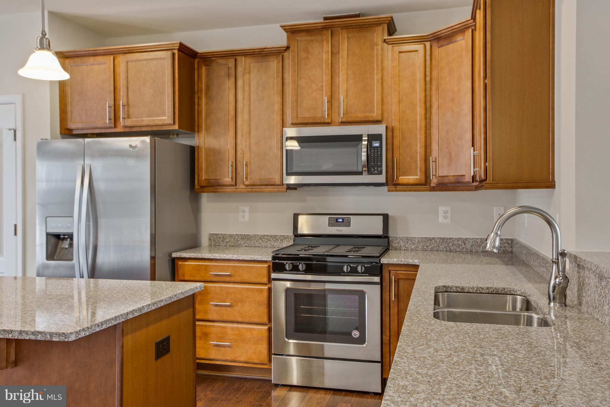7873 Wormans Mill Road Frederick, MD 21701 - Photo 10 of 30 a kitchen with appliances a sink a stove and cabinets