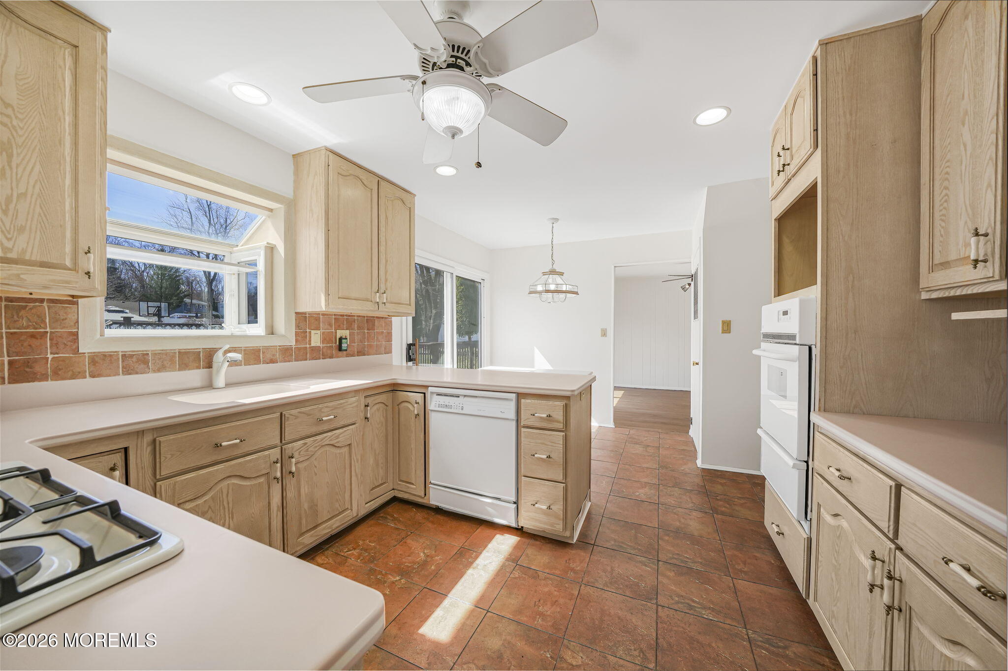 1 Sudbury Road Morganville, NJ 07751 - Photo 13 of 43 a kitchen with white cabinets and white appliances