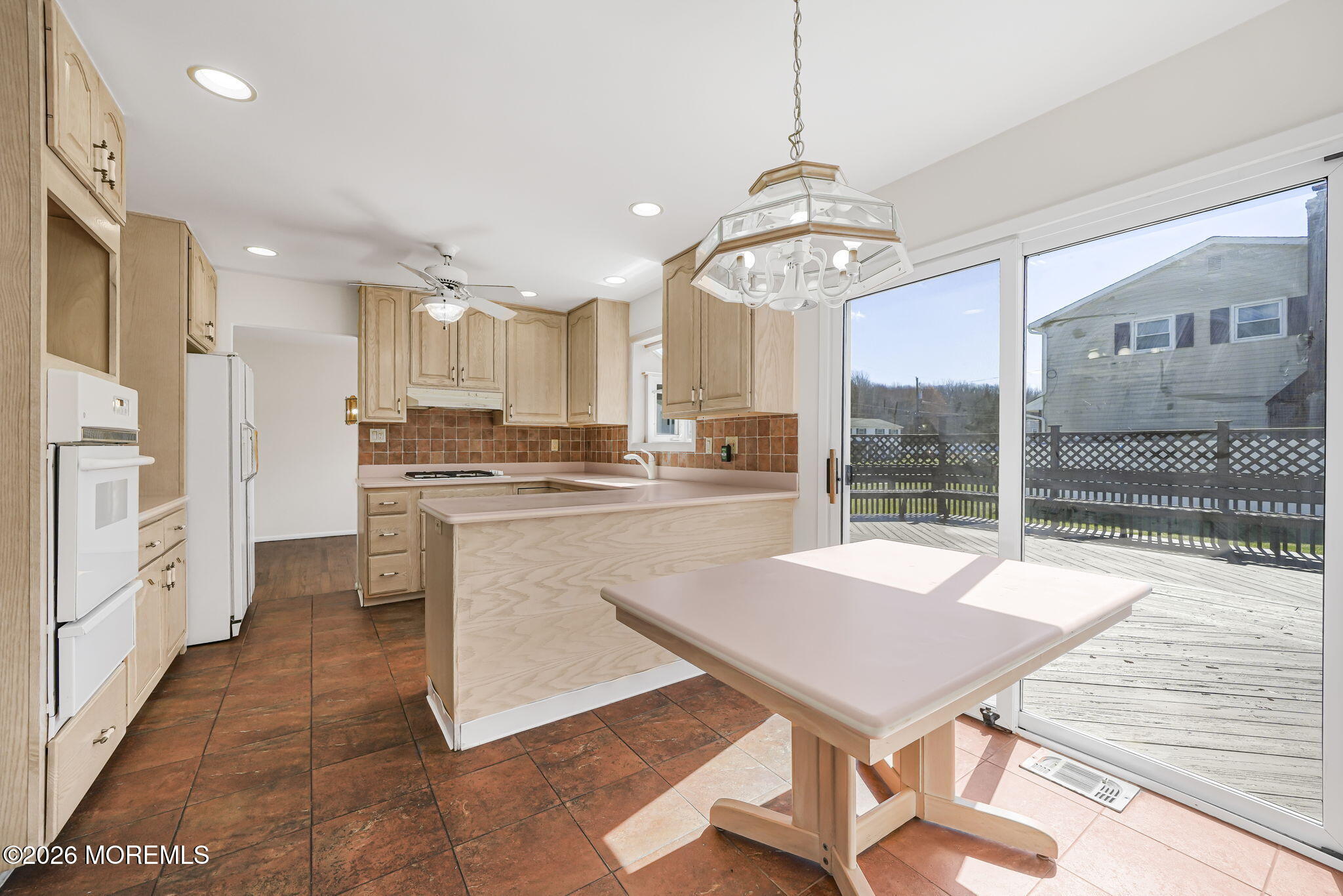 1 Sudbury Road Morganville, NJ 07751 - Photo 14 of 43 a kitchen with stainless steel appliances granite countertop a stove a sink dishwasher and a refrigerator with wooden floor