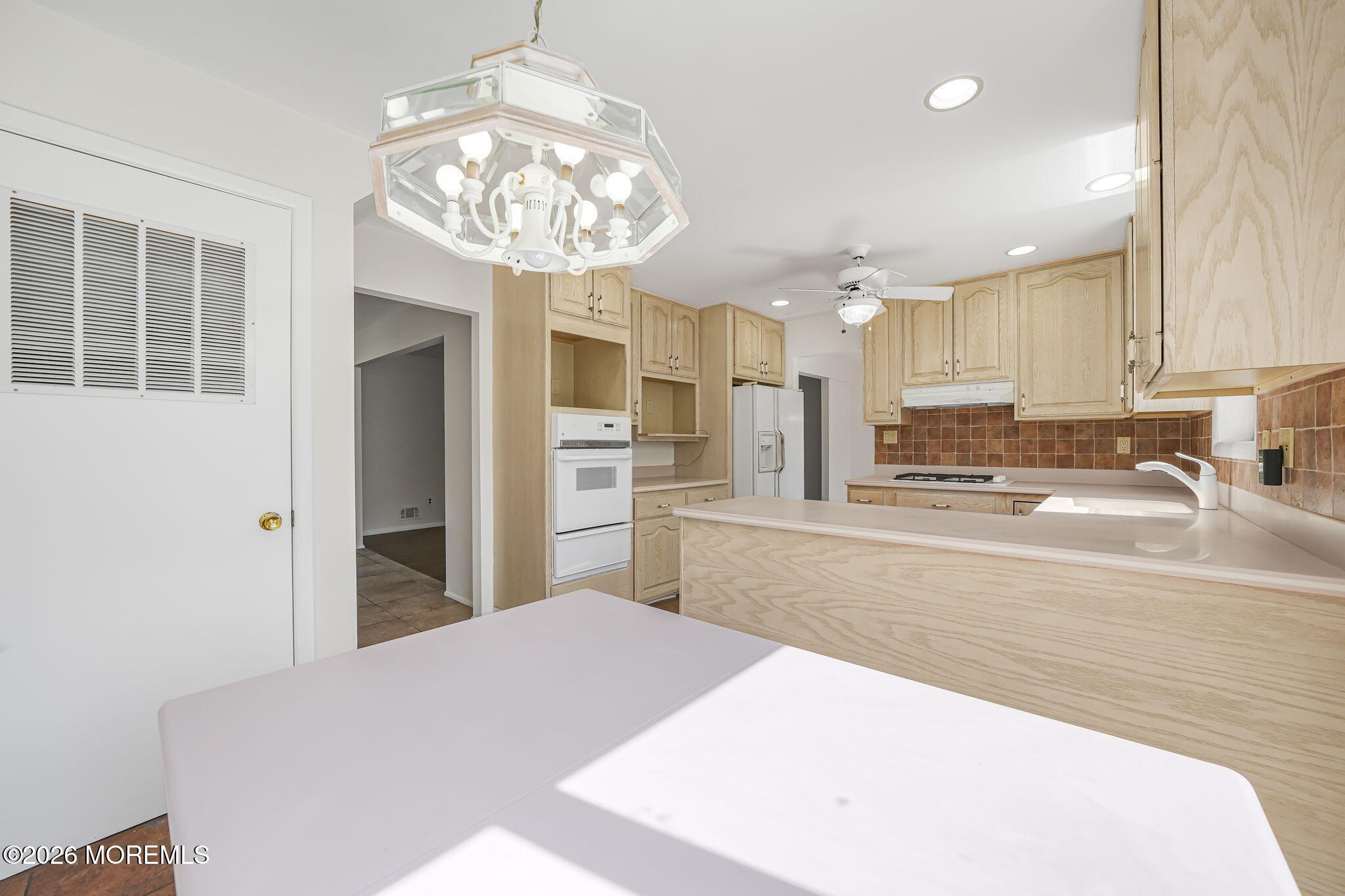 1 Sudbury Road Morganville, NJ 07751 - Photo 15 of 43 a large kitchen with kitchen island a stove a sink a refrigerator and cabinets