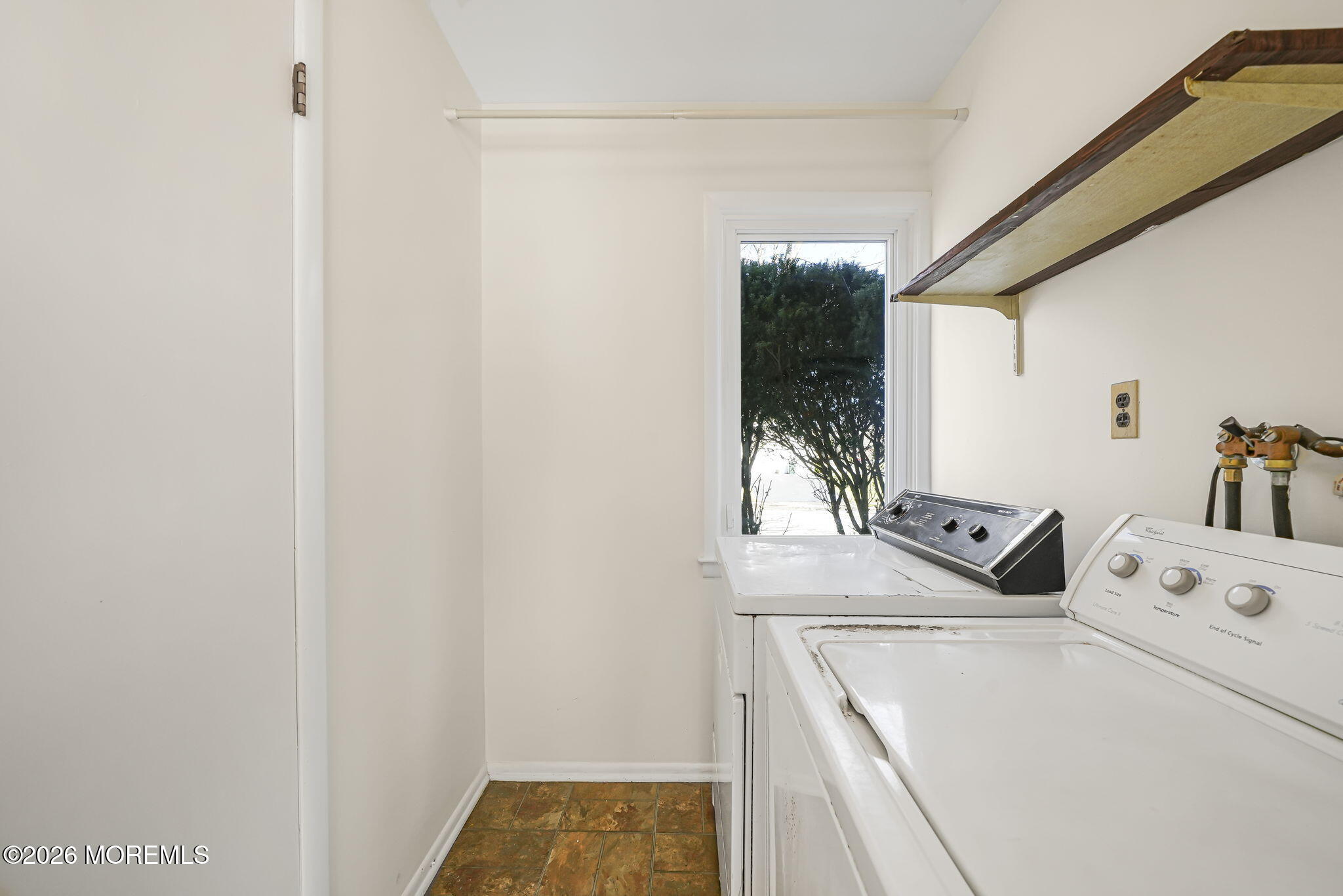 1 Sudbury Road Morganville, NJ 07751 - Photo 20 of 43 a storage room with a washer and dryer