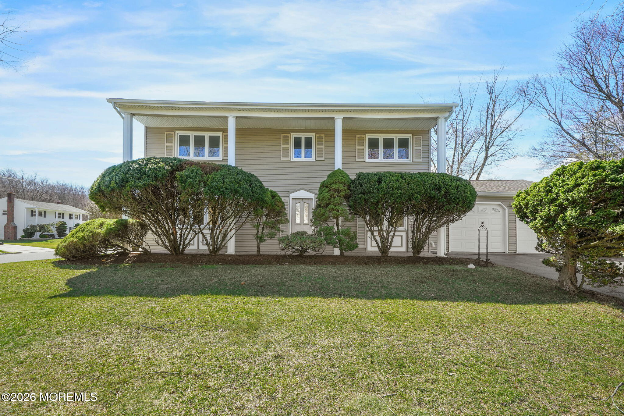 1 Sudbury Road Morganville, NJ 07751 - Photo 2 of 43 a front view of house with yard and green space