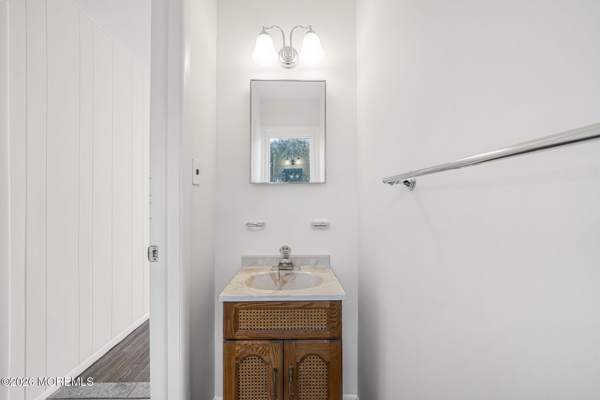 1 Sudbury Road Morganville, NJ 07751 - Photo 21 of 43 a bathroom with a sink a mirror and a toilet