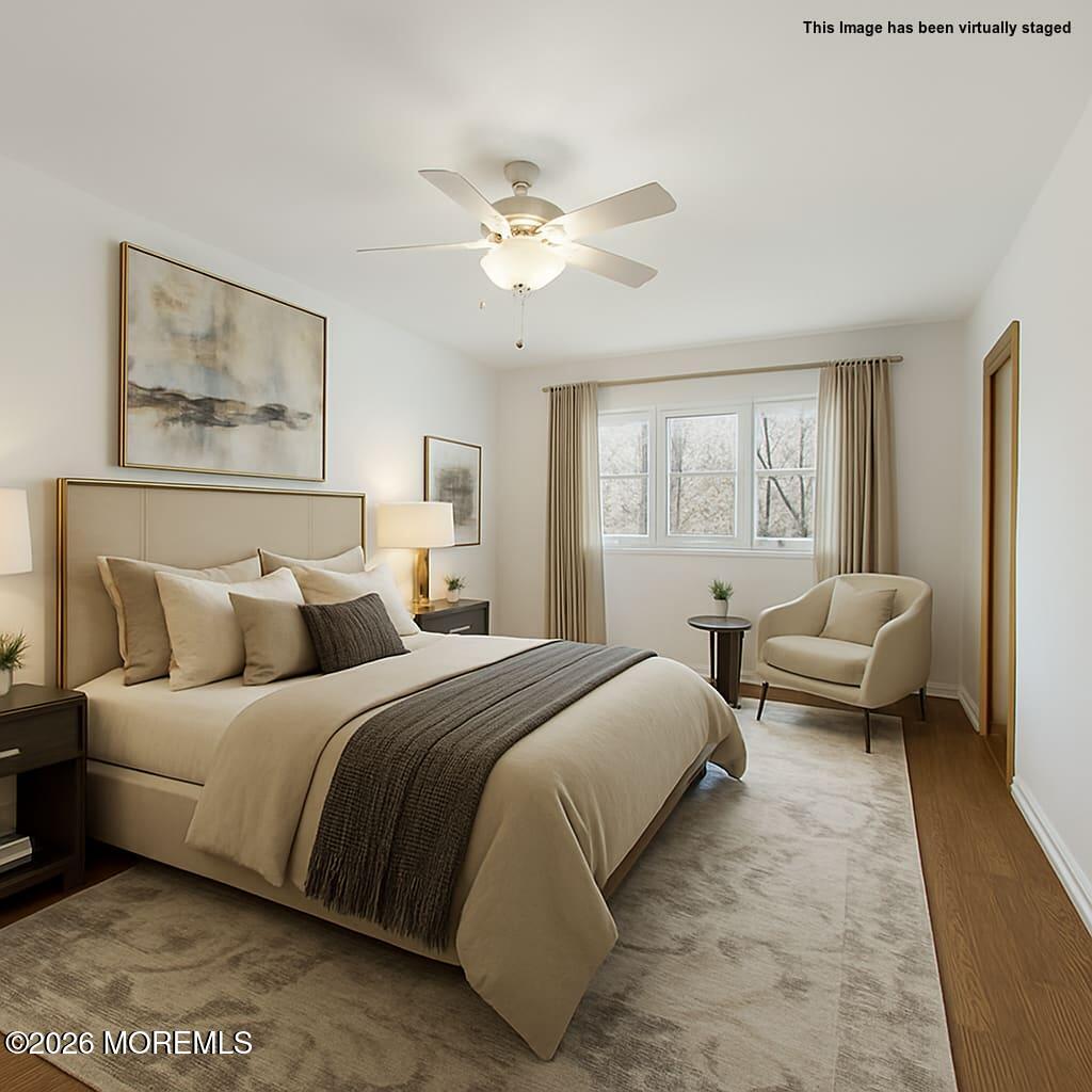 1 Sudbury Road Morganville, NJ 07751 - Photo 24 of 43 a bedroom with a bed and a couch