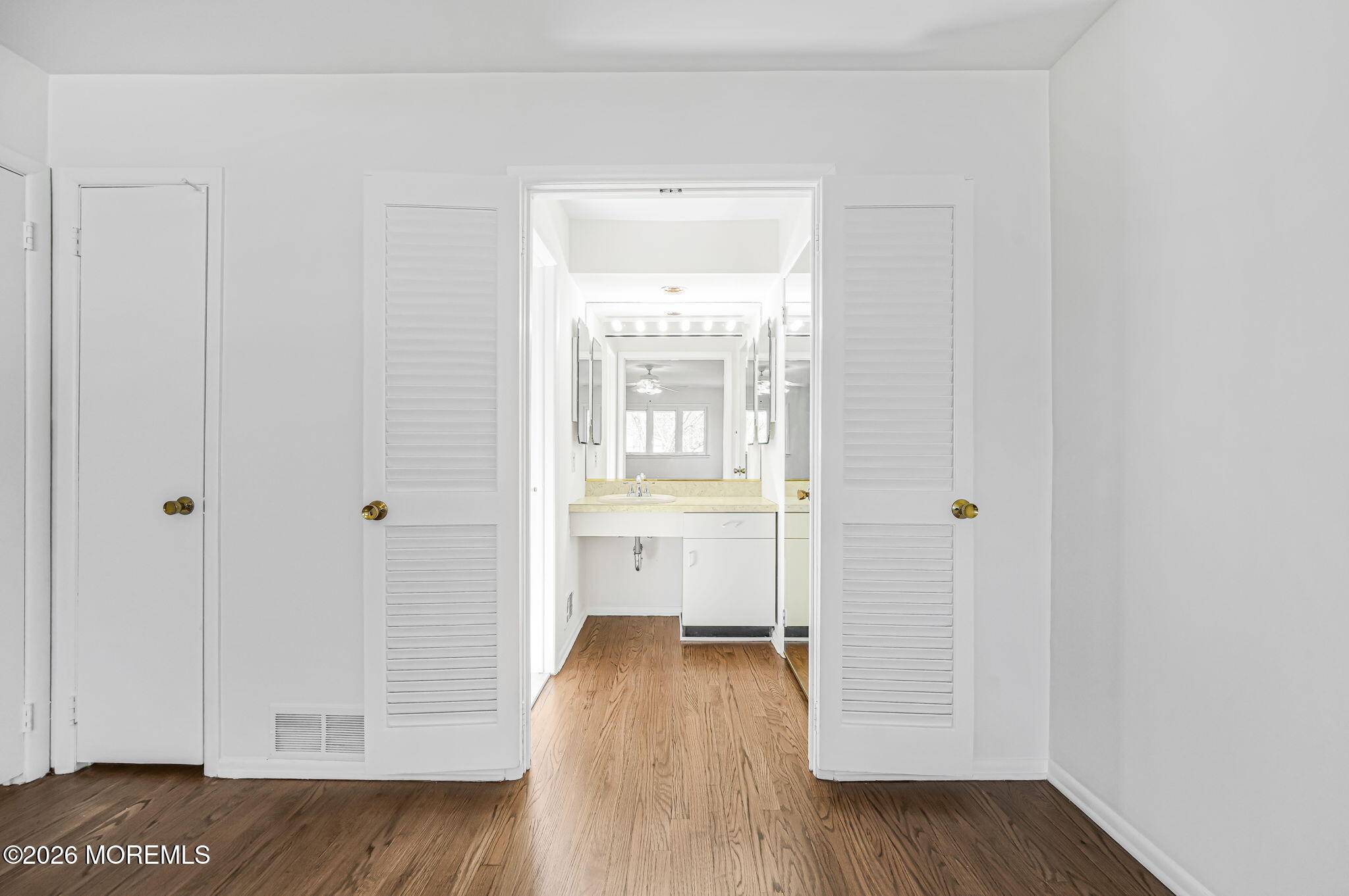 1 Sudbury Road Morganville, NJ 07751 - Photo 26 of 43 a view of a room with wooden floor and window