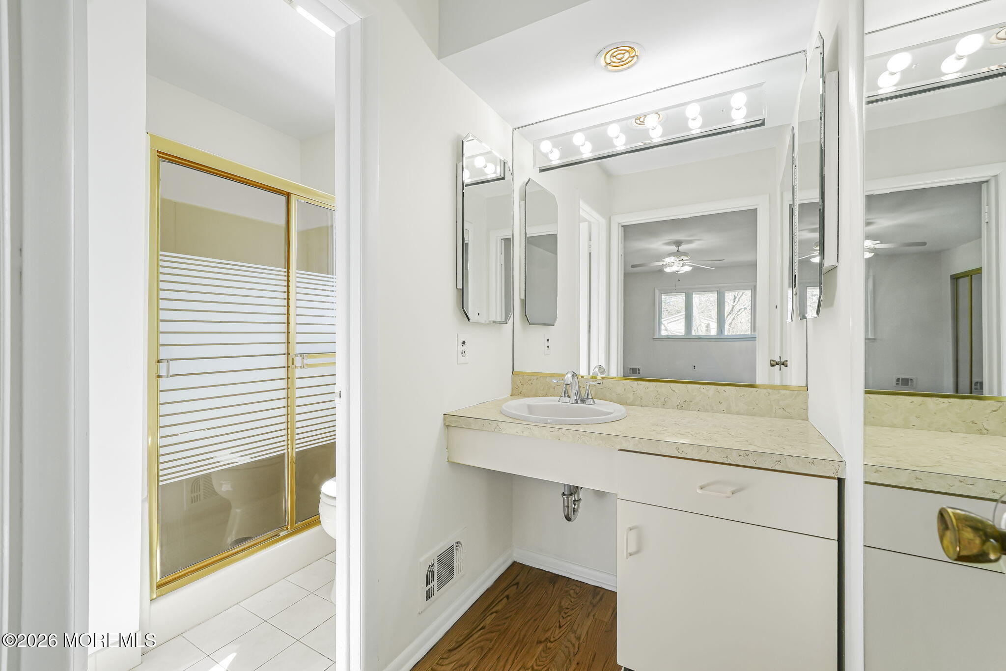 1 Sudbury Road Morganville, NJ 07751 - Photo 27 of 43 a bathroom with a sink and a mirror