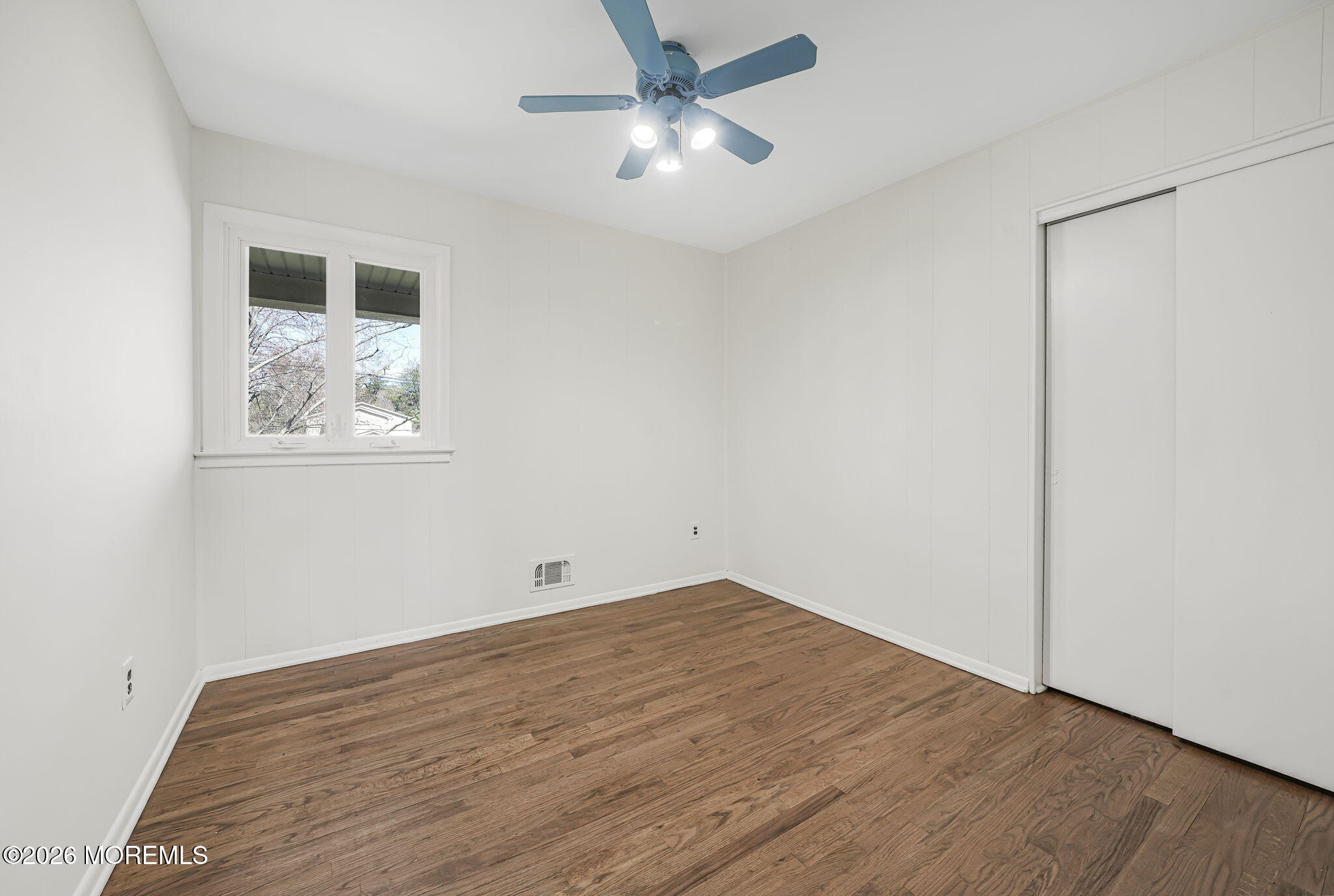 1 Sudbury Road Morganville, NJ 07751 - Photo 28 of 43 a view of a big room with wooden floor and windows