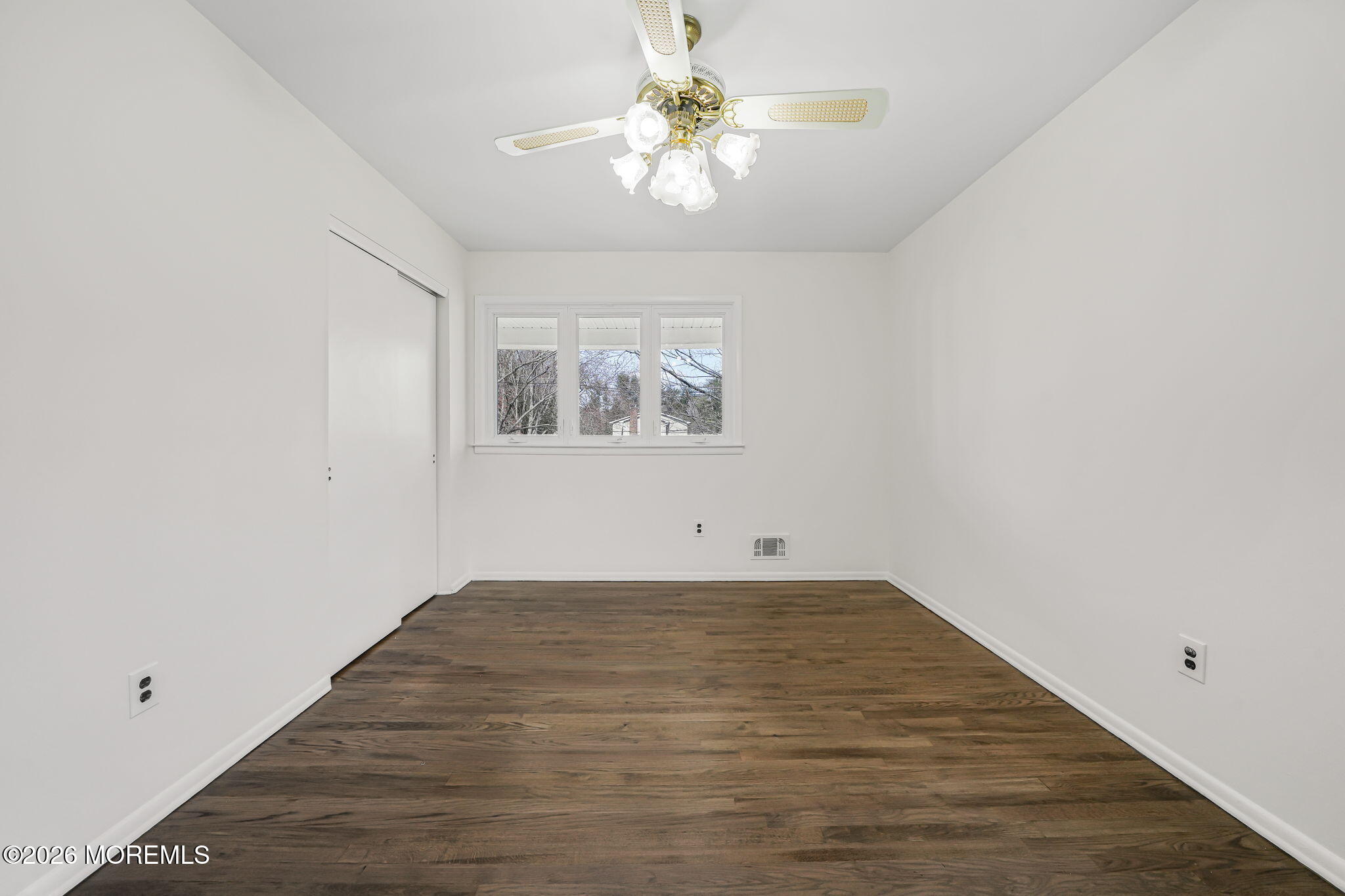 1 Sudbury Road Morganville, NJ 07751 - Photo 29 of 43 wooden floor in an empty room with a window