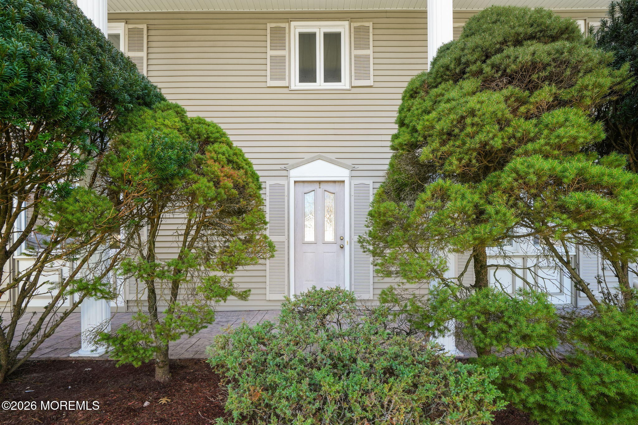 1 Sudbury Road Morganville, NJ 07751 - Photo 3 of 43 a front view of a house with garden